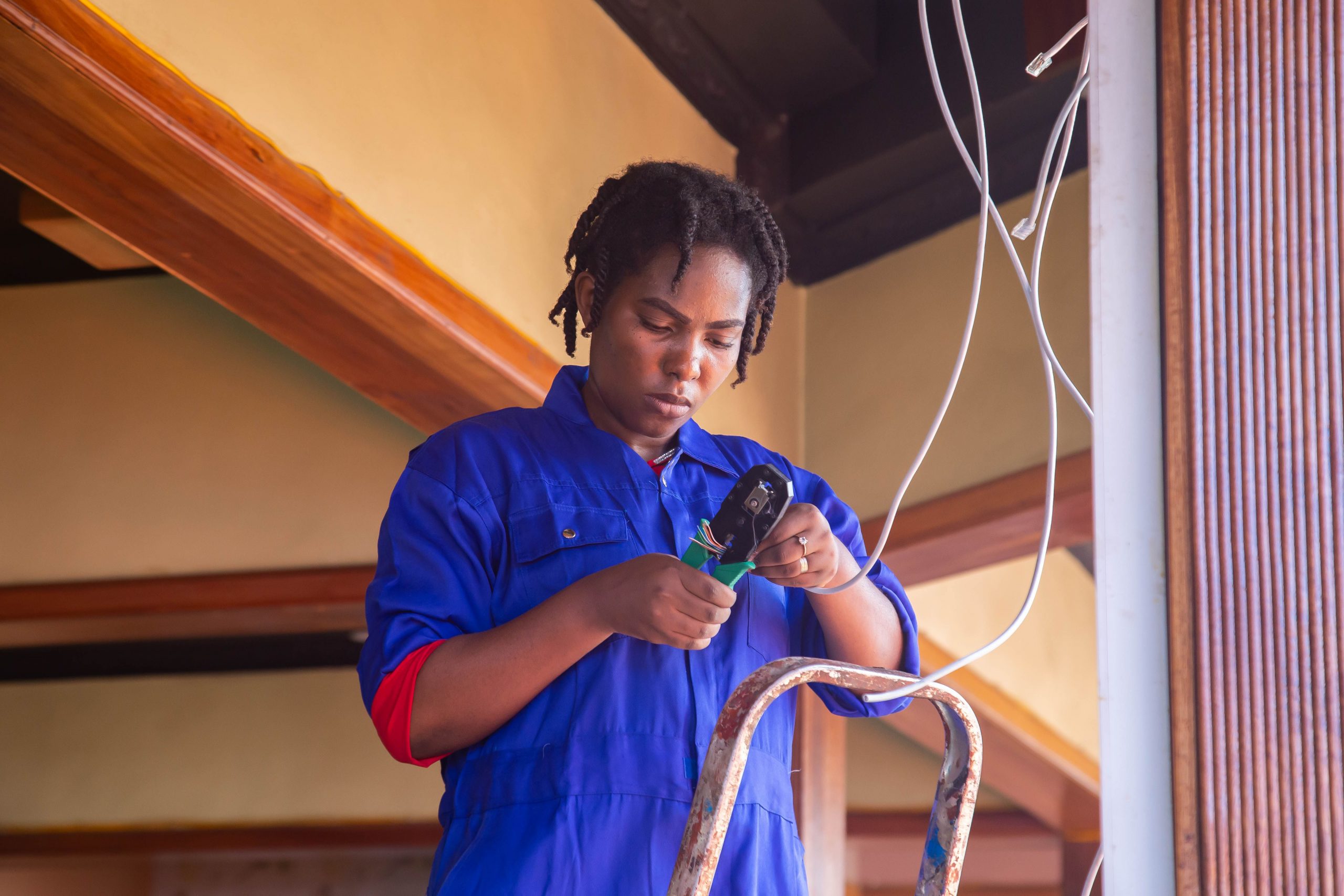 electrician working on wiring in a home